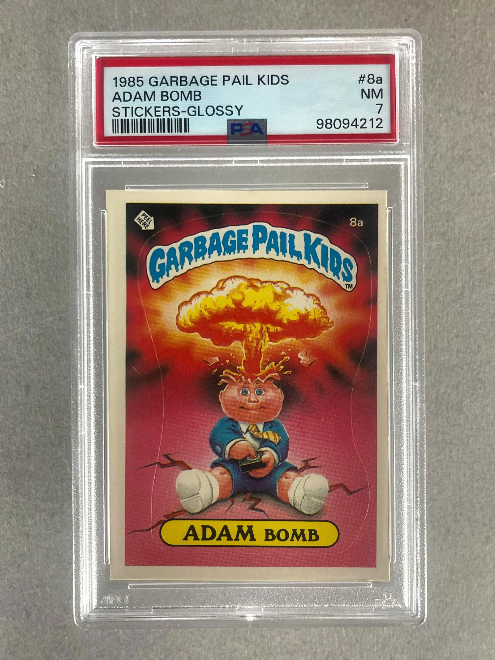1985 Garbage Pail Kids Glossy Adam Bomb #8a PSA 7: Rare Glossy, Cheaters License Back