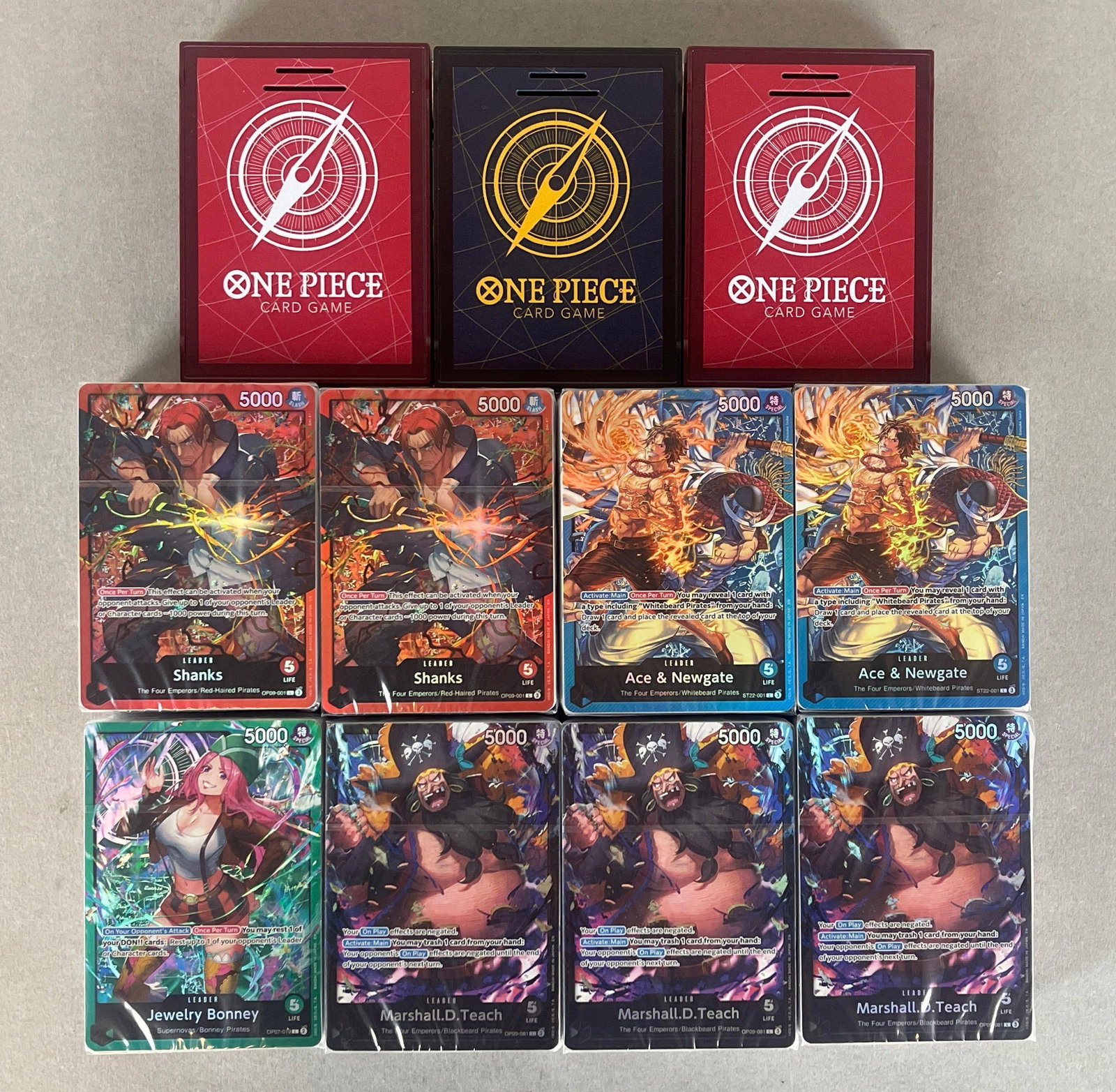 8 - One Piece Starter Decks + 3 Sound Loaders and Rule Sheets: Shanks, Ace and Newgate, Jewelry Bonny, and Marshall D. Teach Showing + Red and Blue Sound loaders