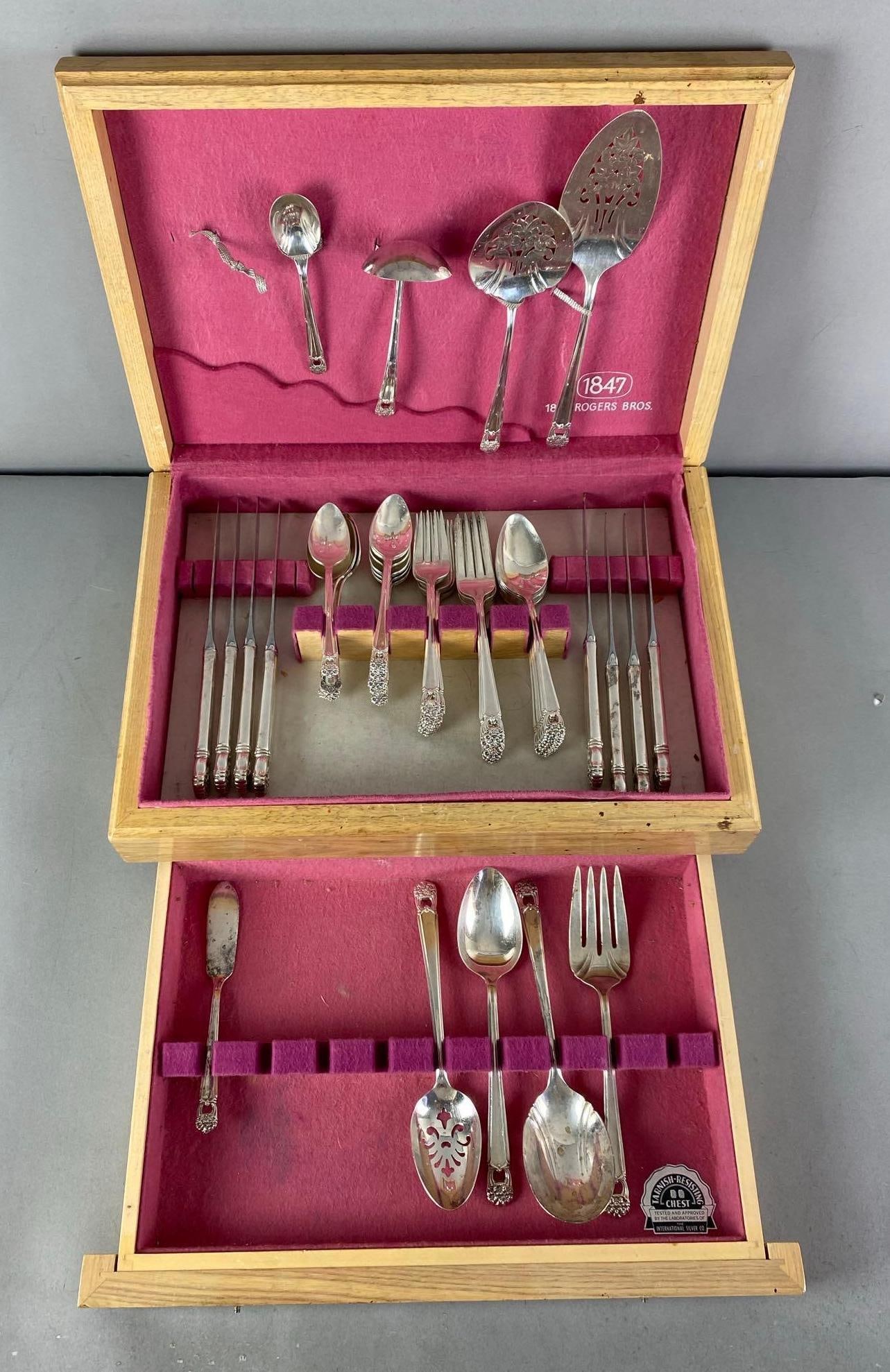 Set of Rogers Bros Eternally Yours Flatware Set: Includes knives, spoons, serving flatware and more, unknown set completion, case measures 6” H x 16 1/2” W x 11 1/2” D