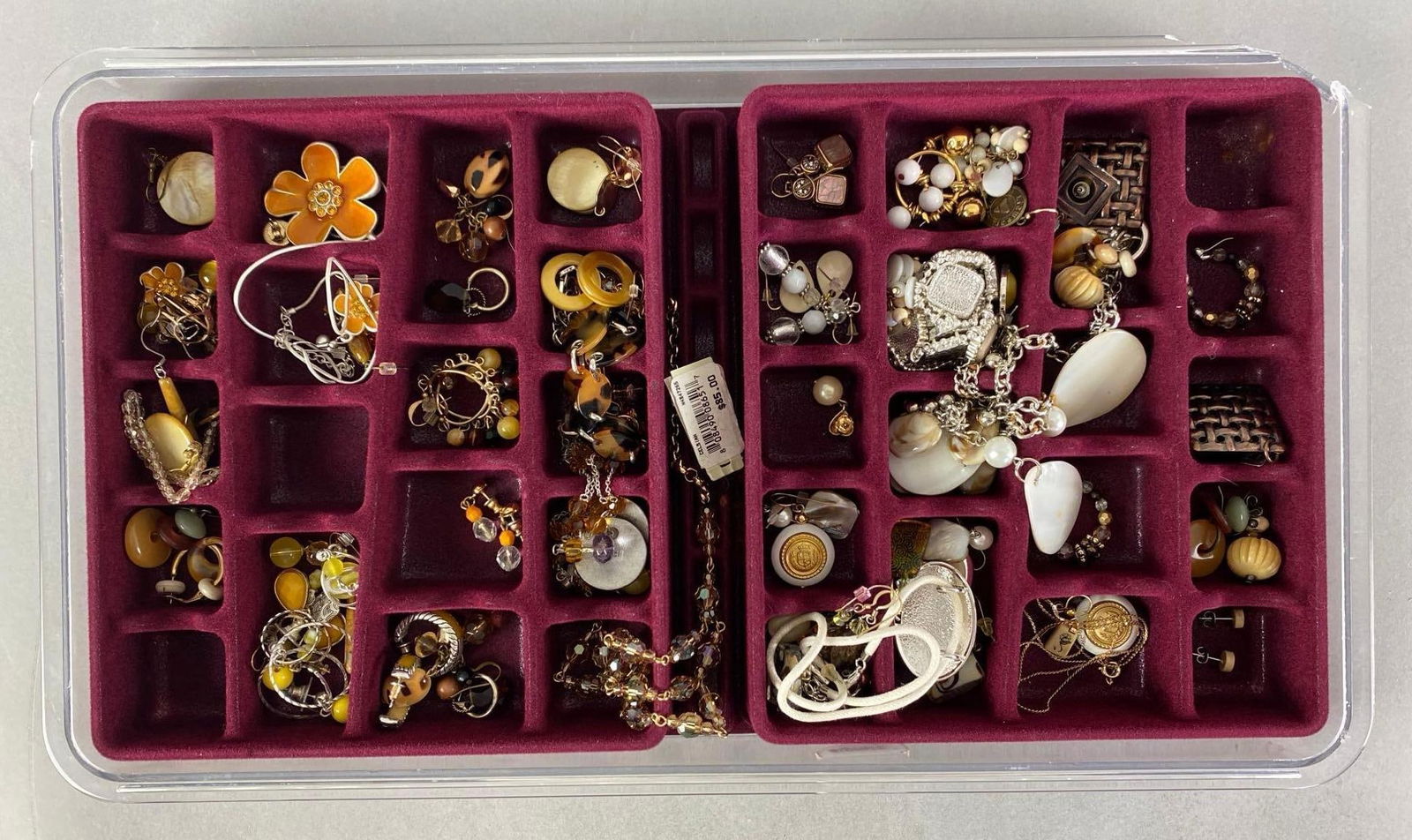 Group of Costume Jewelry: Includes earrings, pins, necklaces and more