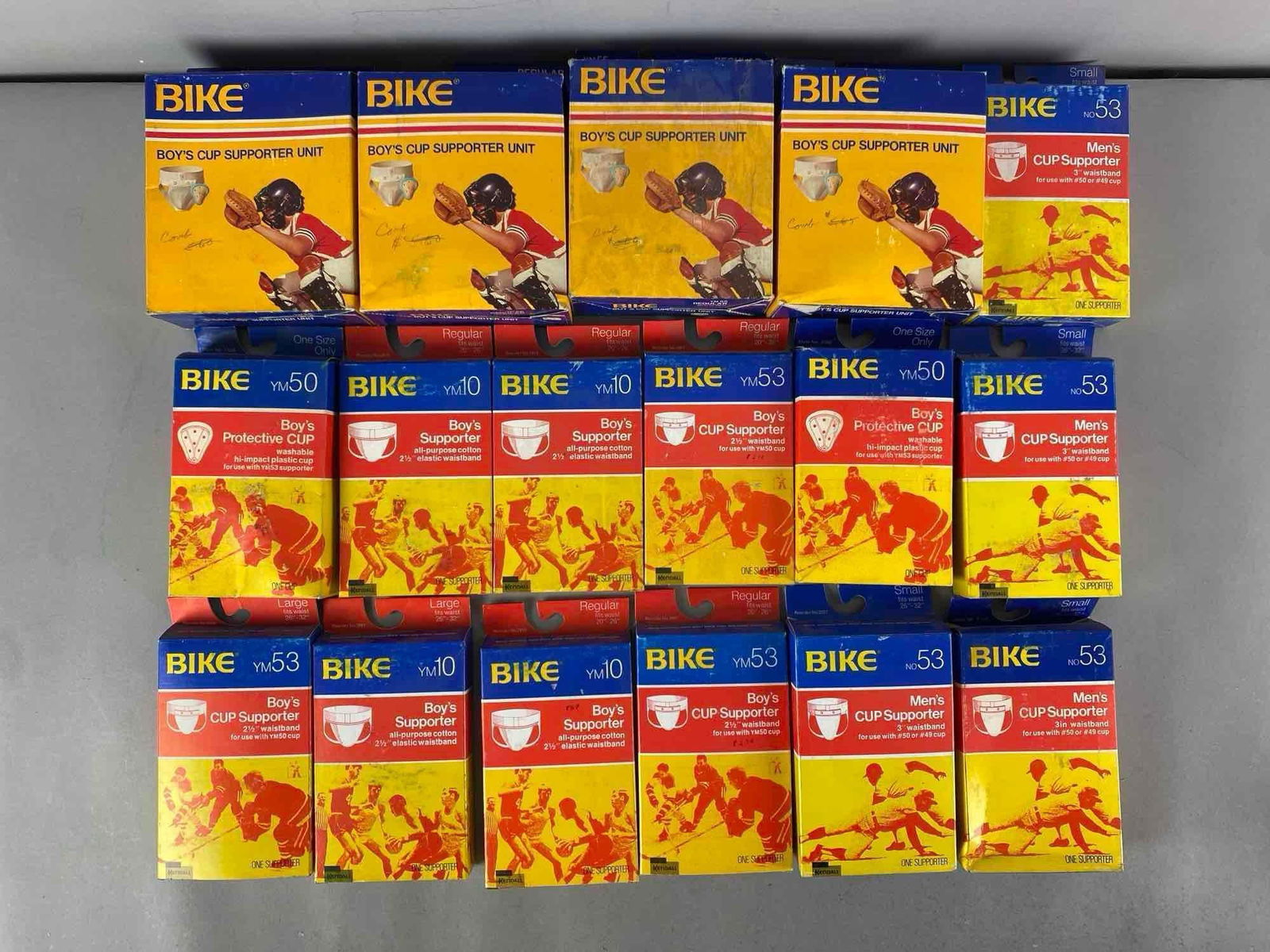 Group of Bike Mens and Boys Cup Supporters: In original boxes, largest measures 8” H x 5 1/2” W x 2 1/2” D