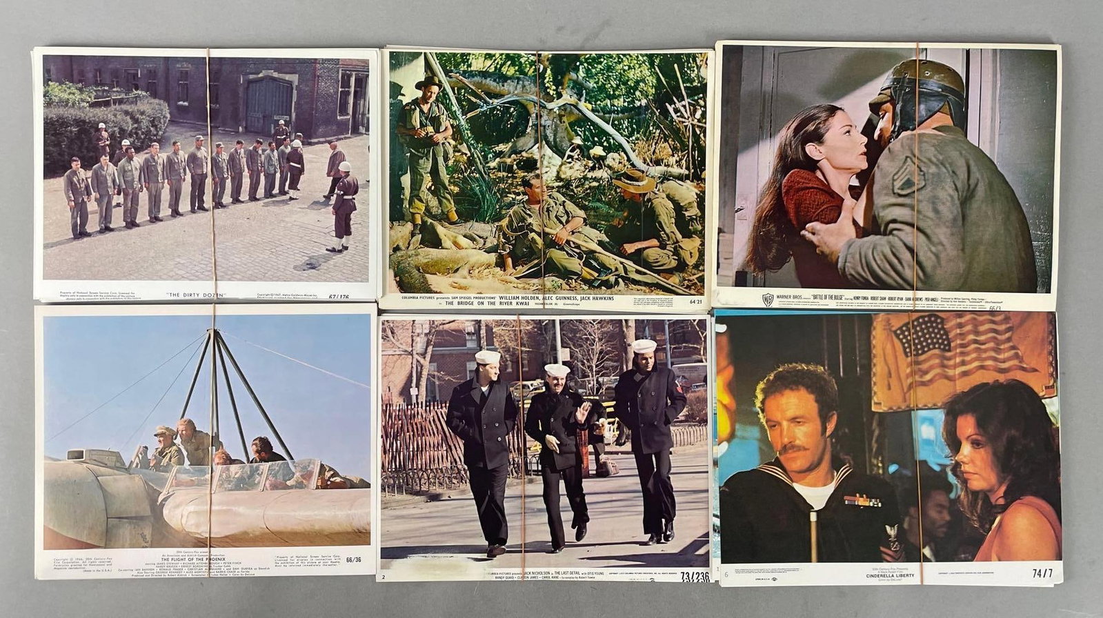 Group of Vintage Movie Stills: Each pile a separate movie with multiple photos in each, includes Jack Nicholson, River Kwai, the dirty dozen