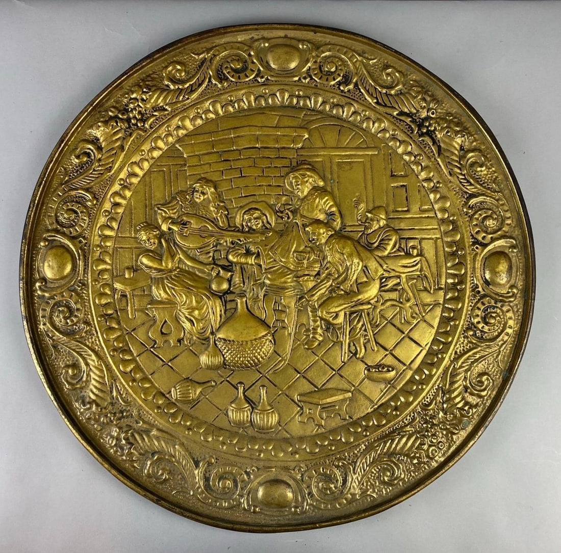 Vintage Peerage England Brass Tin Tavern Wall Plate Decor: Features a Musical Tavern scene. Measures 25” in diameter. Made by peerage in England.