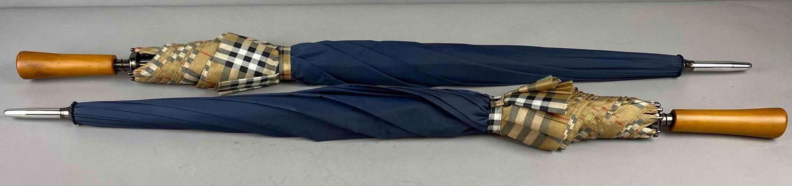 Group of 2 Burberry Patterned Umbrellas: Both measures 40” in length.
