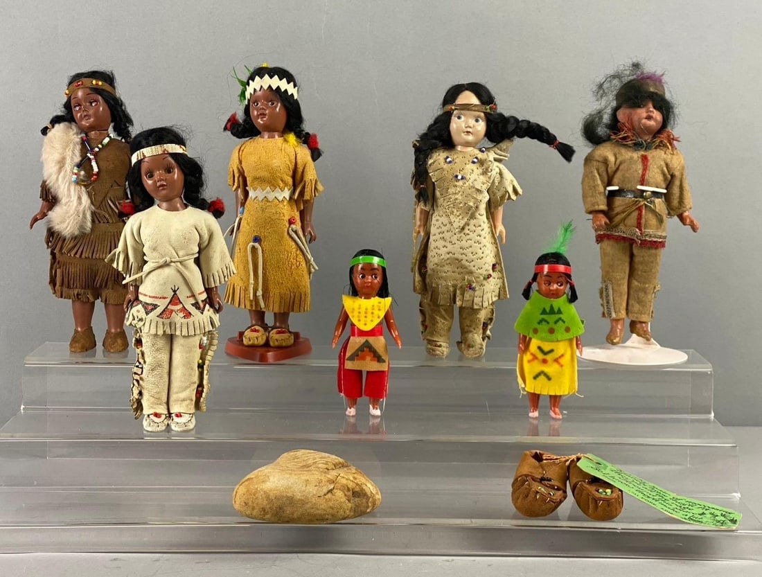 Group of Assorted Vintage Carlson Native American Dolls and More: Includes leather Shoes, Rock, and more. Largest doll measures 7 1/2” tall. Stand not included.