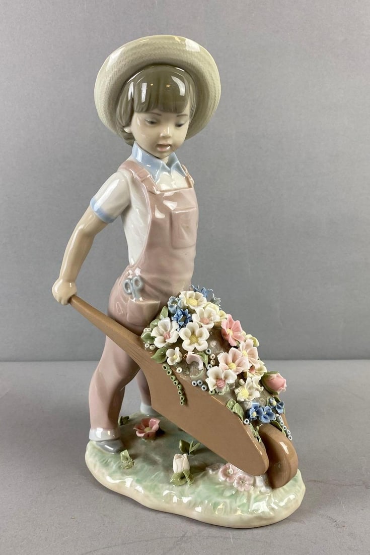 Handmade Lladro Little Gardener Porcelain Figurine: Circa 1970’s. Handcrafted in Valencia, Spain. Measures 9” tall.