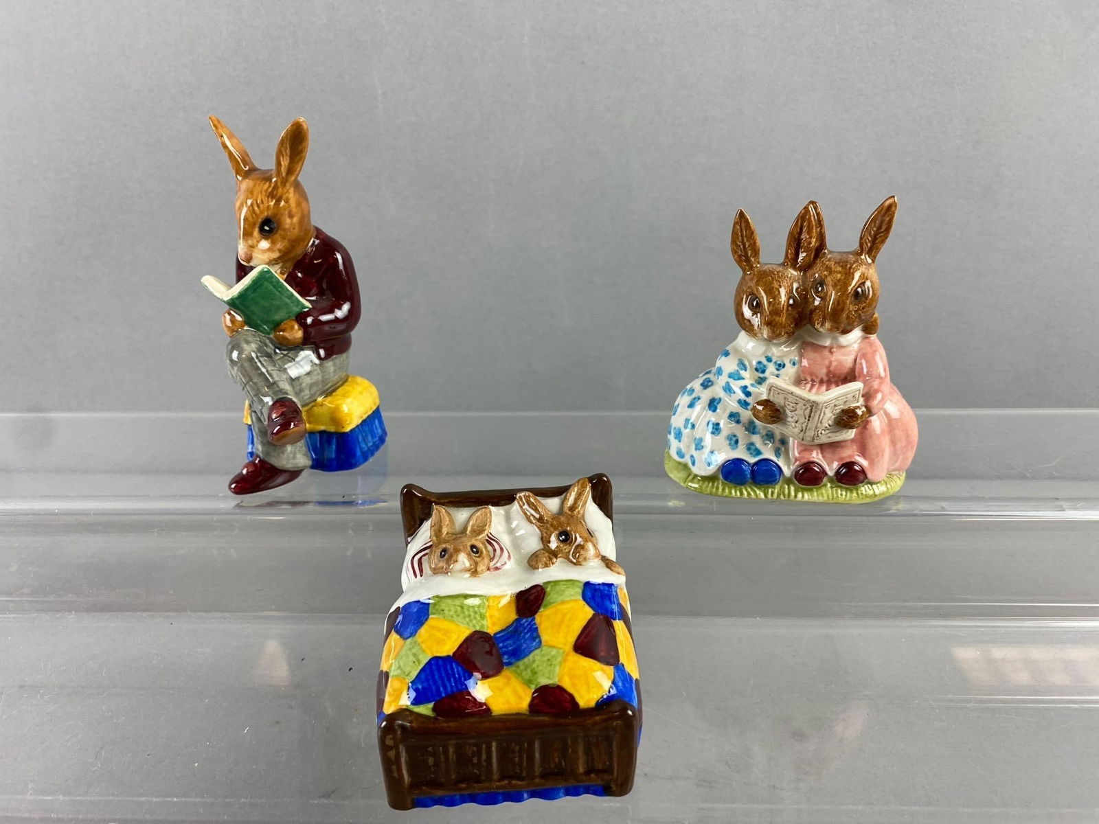 Group of 3 Vintage Royal Doulton Porcelain Figurines: Includes story time, sleepy time, and more. Tallest measures 3”. Stand not included.