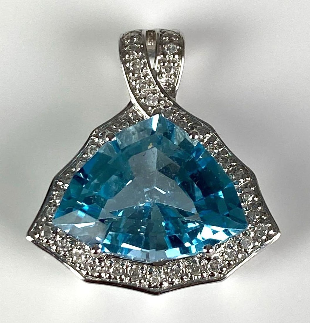 Signed 10K White Gold Blue Topaz Diamond Pendant: total weight of 5 grams, measures 1” H x 3/4” W