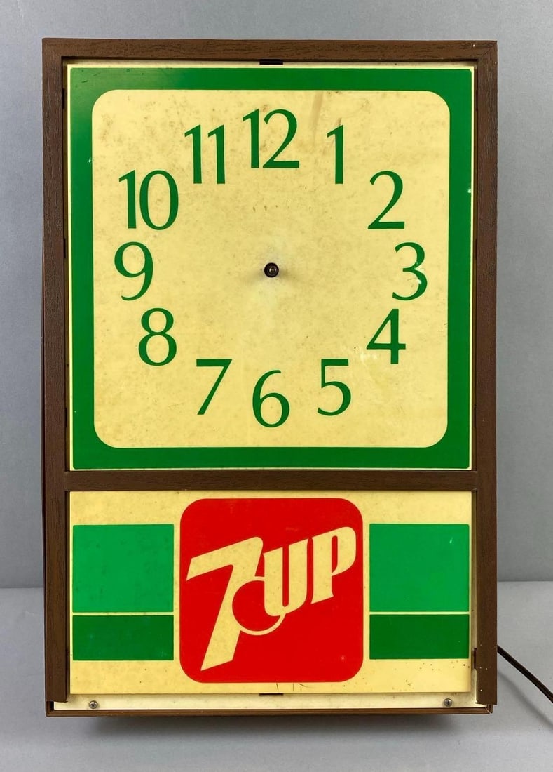7 Up Advertising Wall Clock: Non working condition. Missing parts and only works when cable moved. Measures L 18 x W 12 inches.