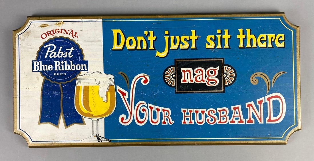 Original Pabst Blue Ribbon Beer Advertising Sign: “ Dont Just Sit There, Nag Your Husband” saying. Measures L 24 x W 11 inches.
