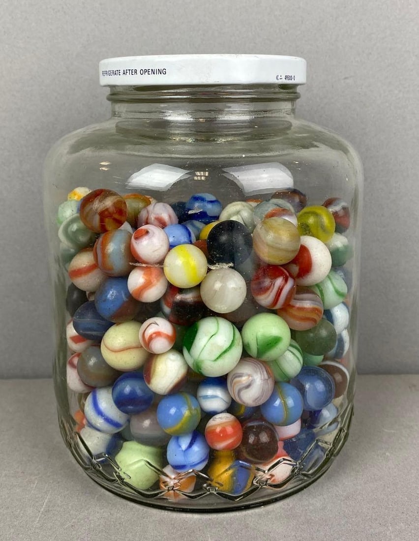 Group of Assorted Vintage Marbles: Some are chipped and some are UV Light reactive. Largest measures .75 inches.