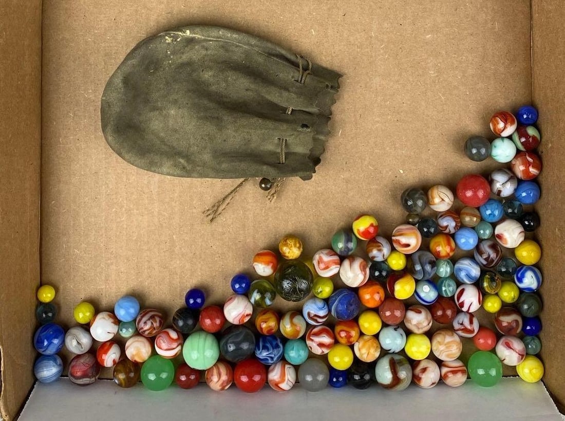 Group of Assorted Vintage Marbles and Marble Bag: Some are chipped. 2 are UV Light Reactive. Largest measures .95 inches.