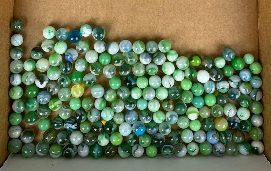 Group of Assorted Vintage Marbles: Some have chipping. 1 is UV Light Reactive. Largest measures .65 inches.