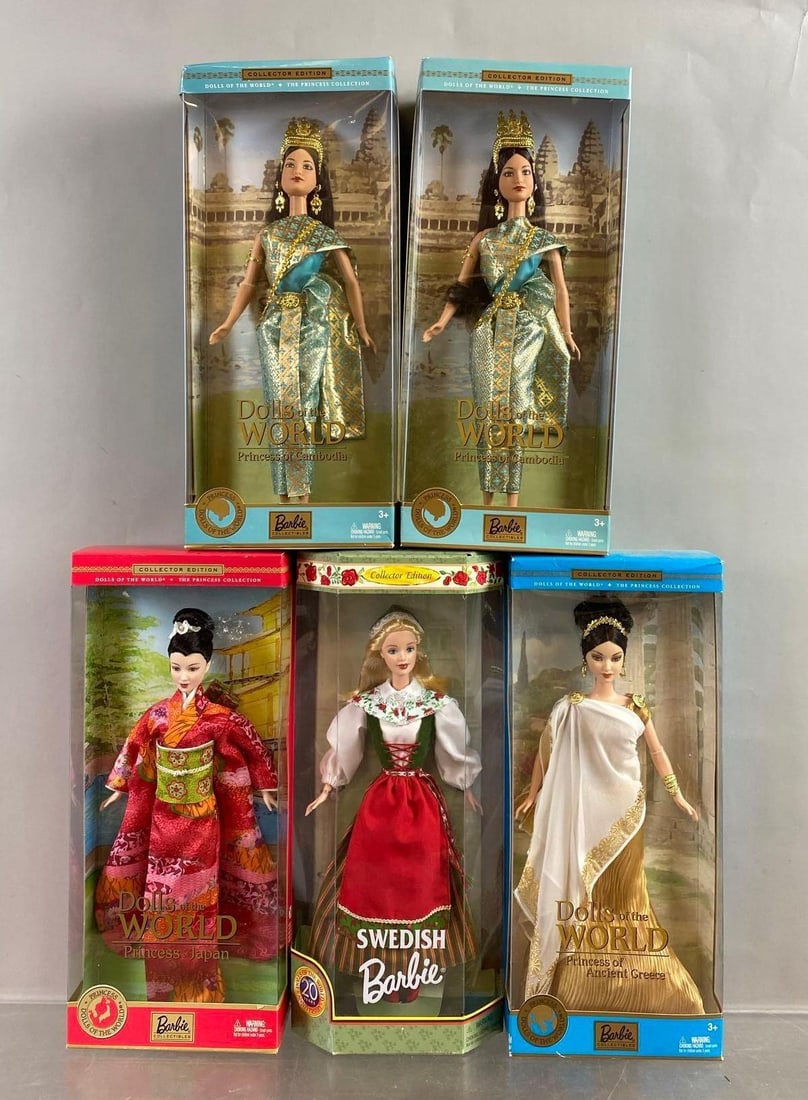 Group of 5 Mattel World Barbie Fashion Dolls: Include Japan, Greece, and more. Mild wear throughout. New in packaging. Circa 2000’s some Duplicates.