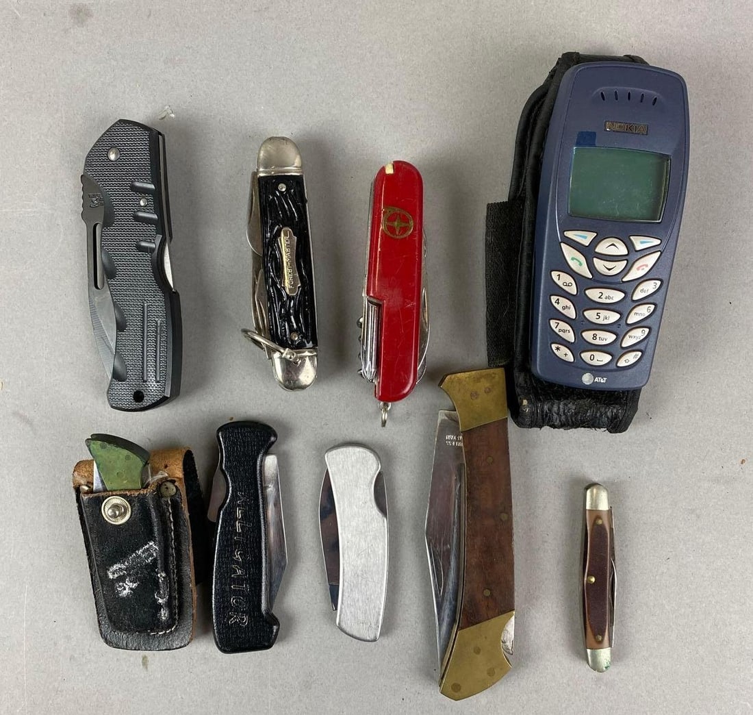 Group of 8 Pocket Knives and More: Includes Nokia Phone. Phone measures H 5 1/2 x D 2 x D 1 3/4 inches.