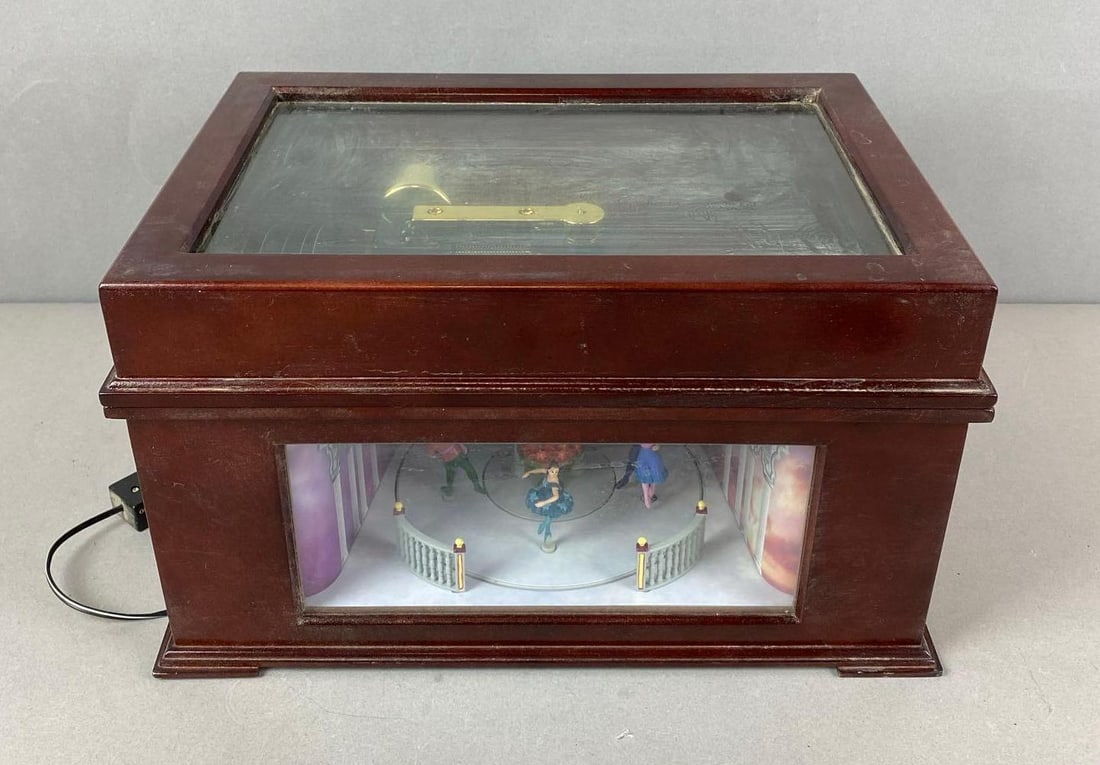 Mr. Music Animated Music Box: Unknown working condition. Missing adapter. Could use a good cleaning. Includes 10 Metal Music Discs. Measures H 7 1/2 x W 13 1/4 x D 9 1/4 inches.