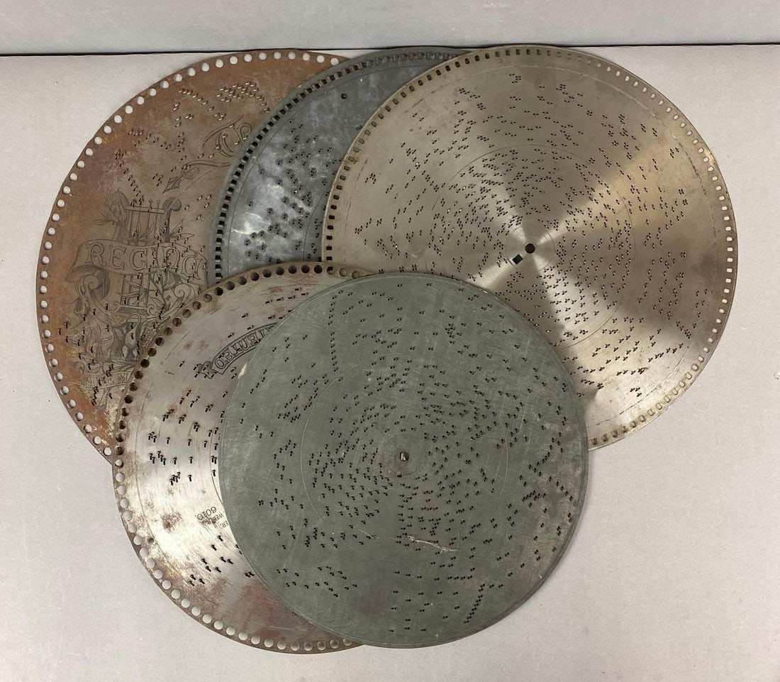 Group of Antique Metal Polyphone Discs: Wear consistent with age. Largest measures H 15 1/2 x W 15 1/2 inches.