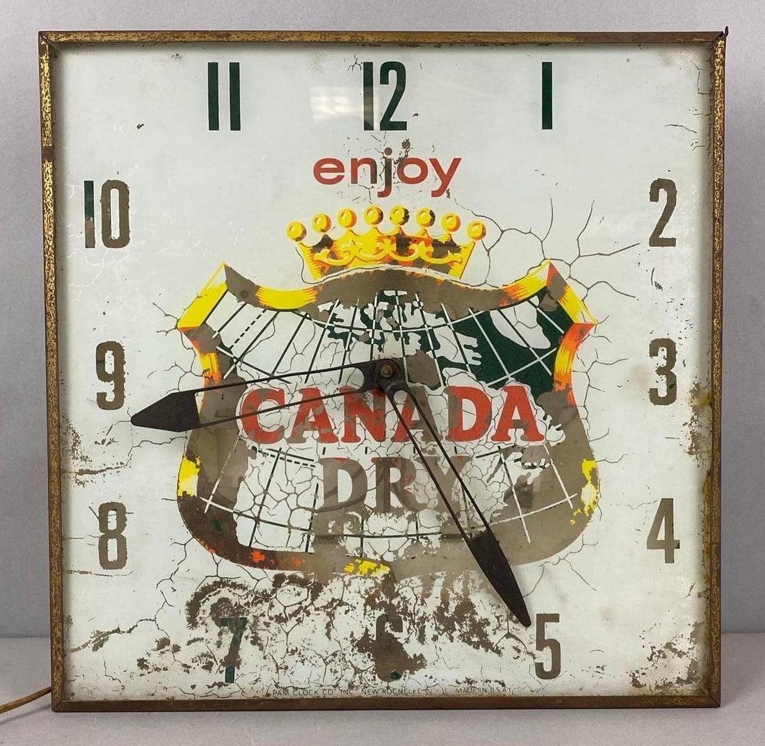 Vintage Canada Dry Light Up Advertising Clock: In working condition. Paint is worn. Measures H 15 1/4 x W 15 1/4 x D 3 1/2 inches.