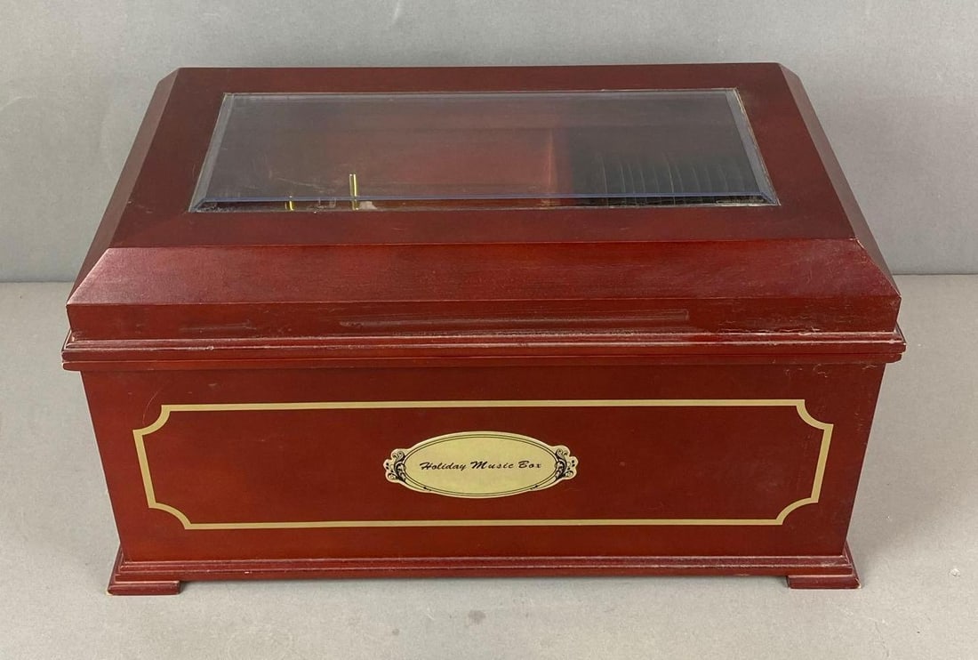 Mr. Christmas Holiday Symphonium Music Player: Untested. missing ac Adapter. Includes 16 plastic music discs. Foot is unattached. Measures H 8 1/2 x W 16 1/4 x D 9 1/4 inches.