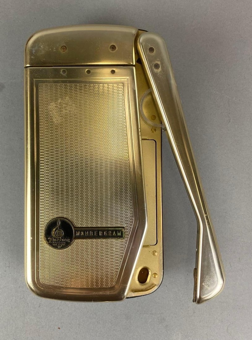 Vintage 60’s Emerson Wondergram Portable Record Player: Unknown working condition. Case has a few rips and is missing carrying strap.Measures H 5 x W 9 x D 2 1/2 inches.