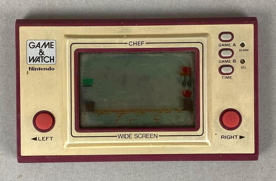 1981 Nintendo Chef Game and Watch: Unknown working condition. Measures H 2 3/4 x W 4 1/2 x D 1/2 inches.