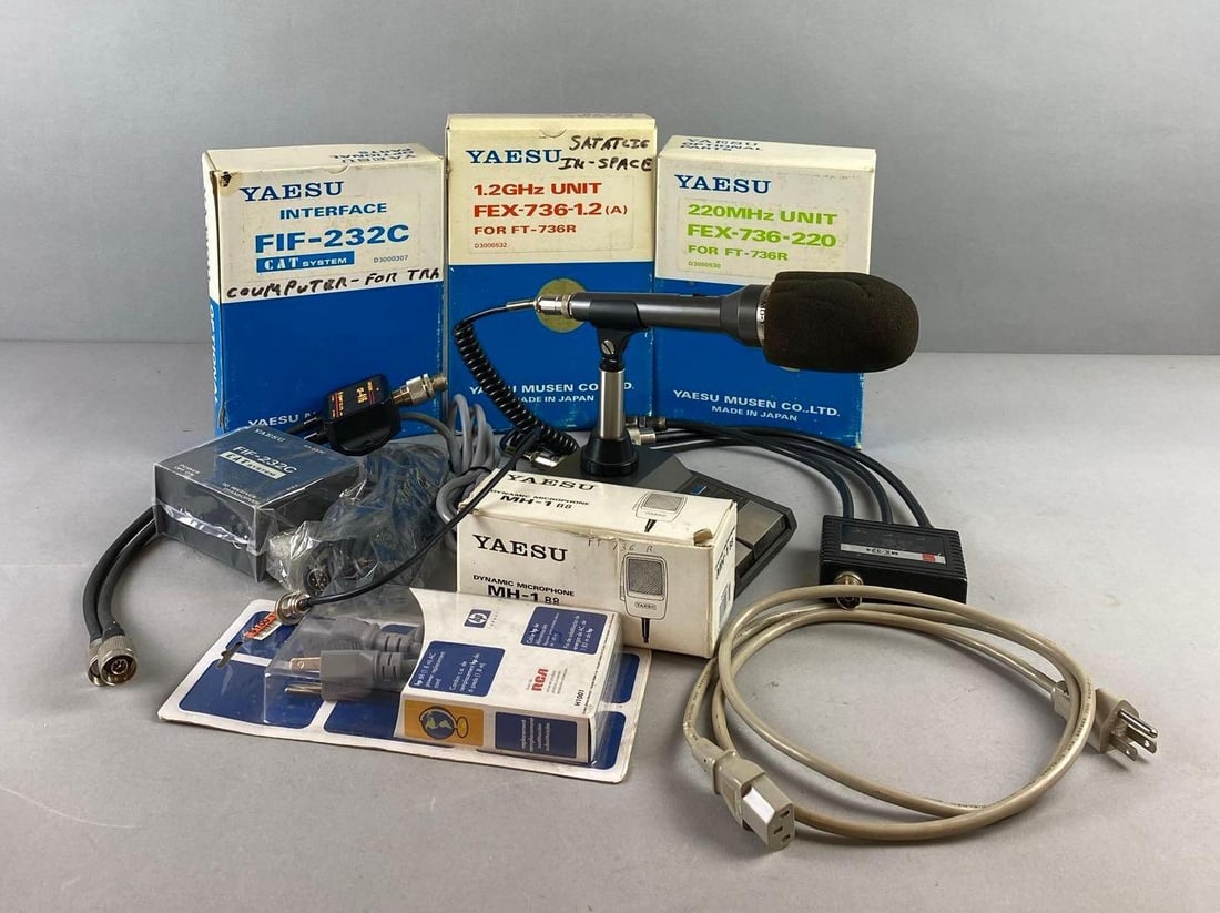 Group of Assorted Yaesu Radio Receiver Accessories and More: Untested. Largest item measures H 3 x W 6 1/2 x L 10 inches.