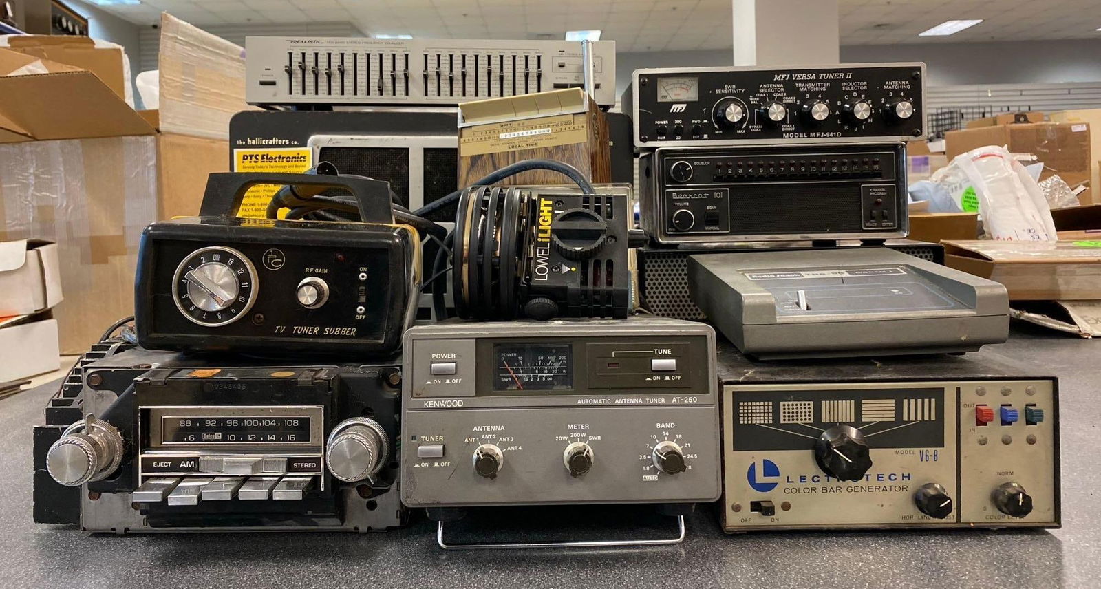 Group of Assorted Electronic Equipment: Includes Kenwood Antenna Tuner, Bearcat 101, and more. Untested. Largest measures H 11 x W 8 x L 15 inches. No in house Shipping. Third party recommended.
