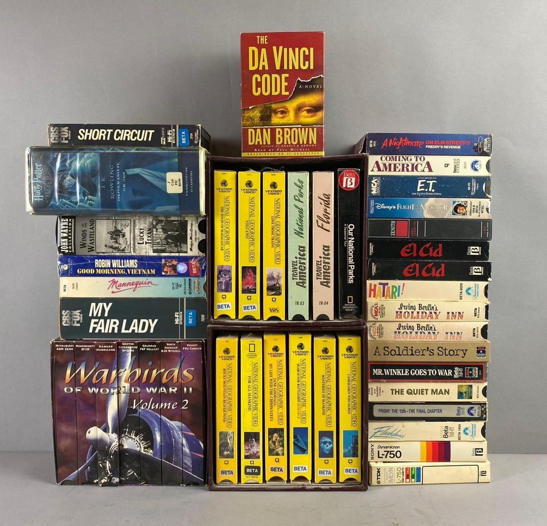 Group of Assorted Beta / VHS Tapes: Includes Classics such as E.T., Short Circuit, and More. Largest measures H 8 x W 4 x L 8 inches.