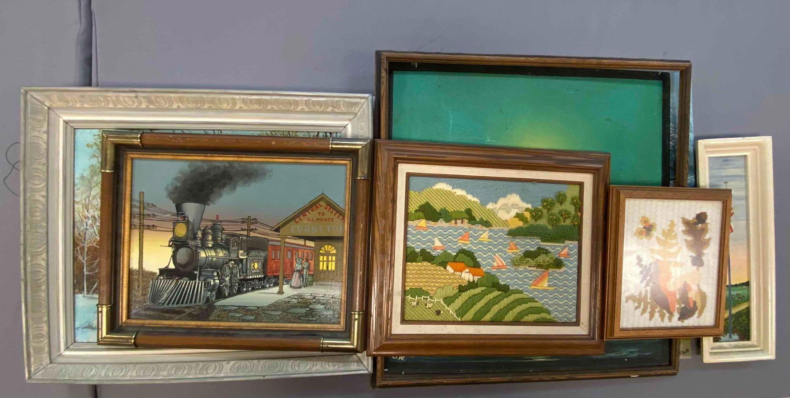 Group of Assorted Canvas Paintings and More: Includes locomotive, mountain La, and more. Largest measures L 33 x W 21 inches.