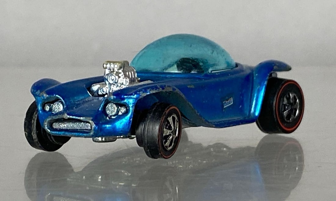 1967 Mattel Hot Wheels Redline Beatnik Bandit: Die-cast, redline tires, made in Hong Kong, blue windows, Light Blue paint, paint scratches skirts and fenders
