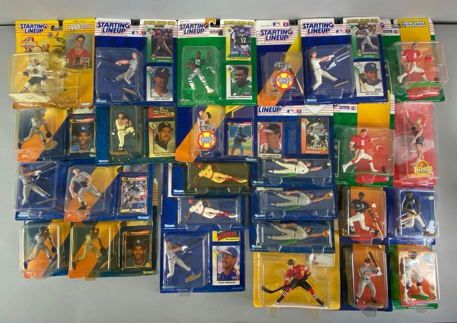Group of 1990s Kenner Starting Lineup Sports Figurines: Group of 1990s Kenner Starting Lineup Sports Figurines, Includes Bip Robert?s Juan Gonzalez and more, largest measures 9? H x 8? W x 2? D