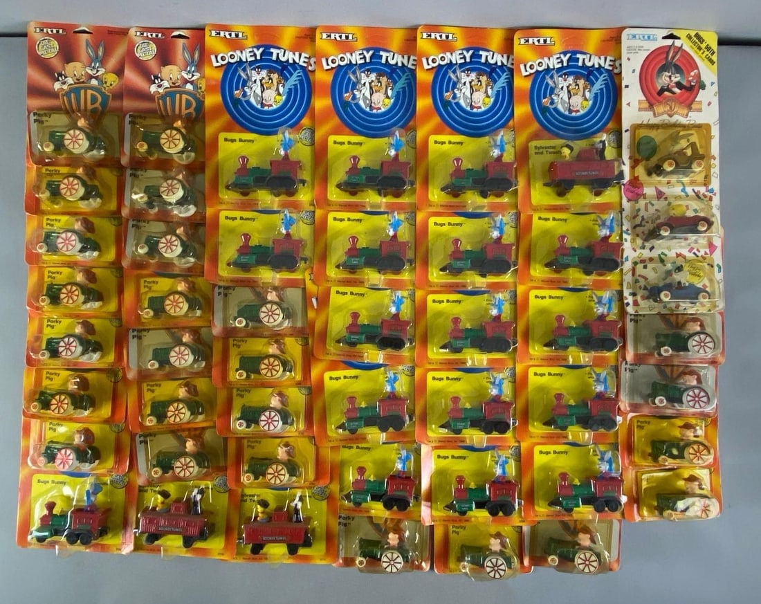 Group of ERTL Looney Tunes Die-Cast Vehicles: Includes bugs bunny train, porky pig tractor and more