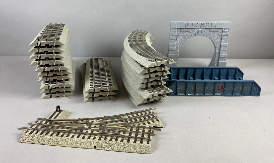 Group of 23 Lionel Trains O Scale Tracks and More: Include Tunnel Arch and Polar Express Bridge. Largest track measures 15? in length.