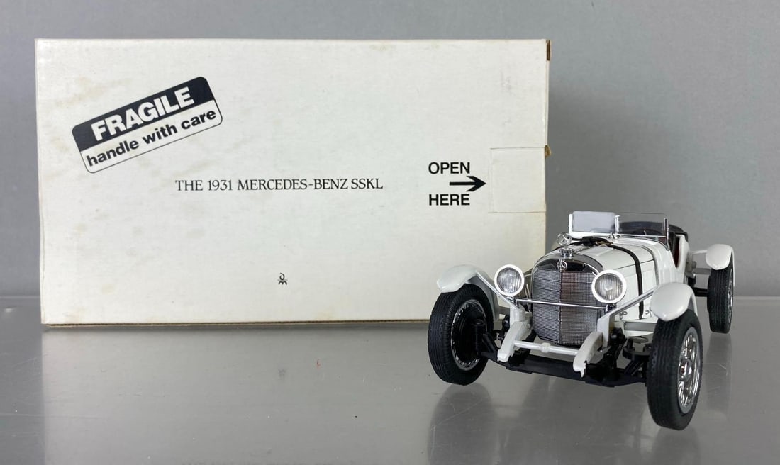 The Danbury Mint 1936 Mercedes Benz SSKL Die Cast Vehicle: Like new in original packaging. Circa 1990?s. Measures H 5 x W 5 x L 9 1/2