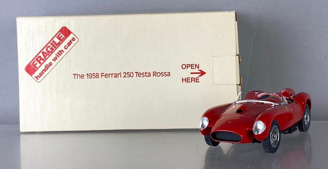 The Danbury Mint 1958 Ferrari 250 Testa Rossa Die Cast Vehicle: Like new in original packaging. Box measures H 5 x W 5 x L 5 inches. Circa 1990?s.