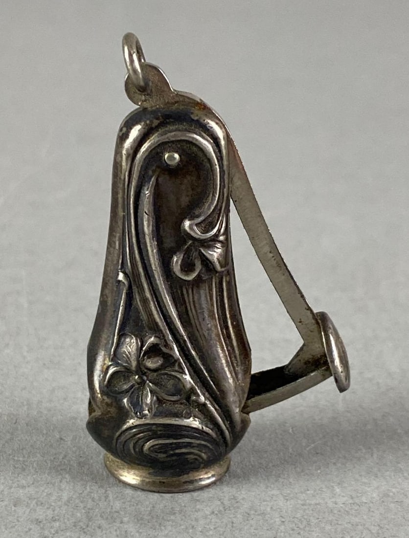 Antique Sterling Silver Floral Cigar Cutter: Marked on interior, inscribed on push lever, measures 2” H x 1” W x 1/2” D