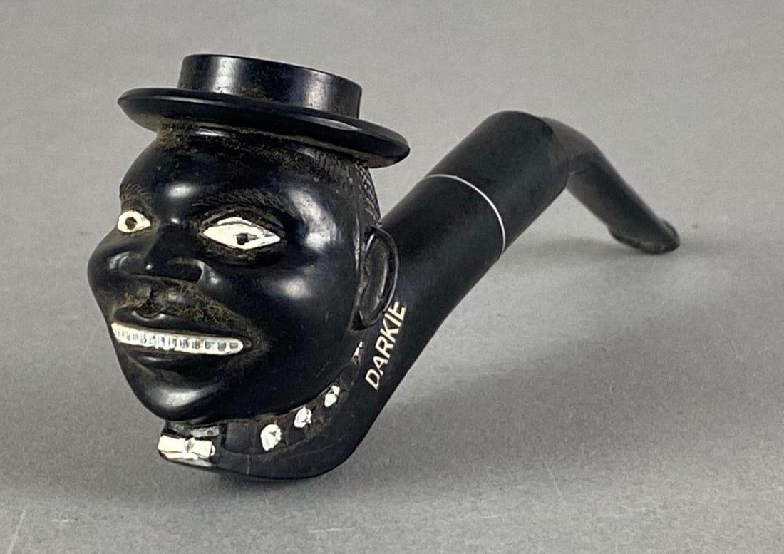 Vintage Black American Darkie Tobacco Pipe: Needs cleaning, measures 2 1/2” H x 1 1/2” W x 5 1/2” D