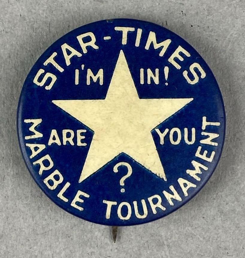 Vintage Star Times Marble Tournament Pin Back: Measures H 1 1/4 x W 1 1/4 inches.