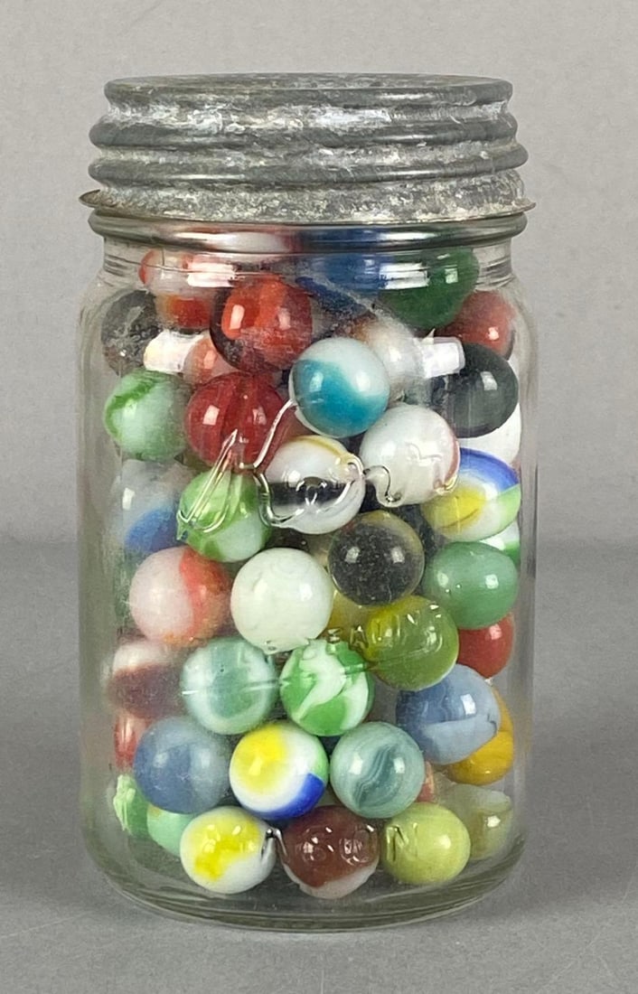 Glass Jar of Assorted Glass Marbles: jar measures 5 1/4” H x 3” W