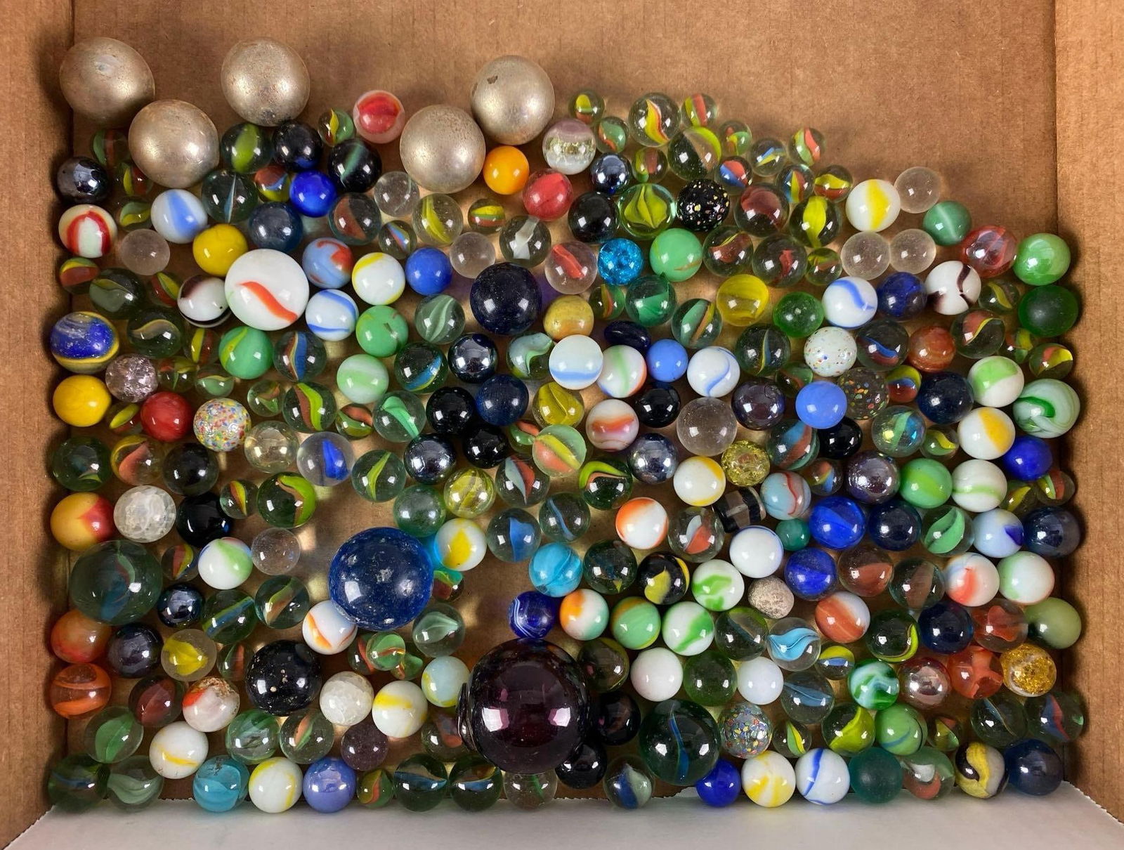 Group of 180+ Assorted Marbles: Includes Metal and glass, largest measures 1.5”