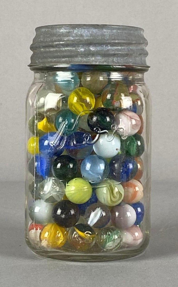 Glass Jar of Assorted Glass Marbles: Jar measures 5 1/4” H x 3” W