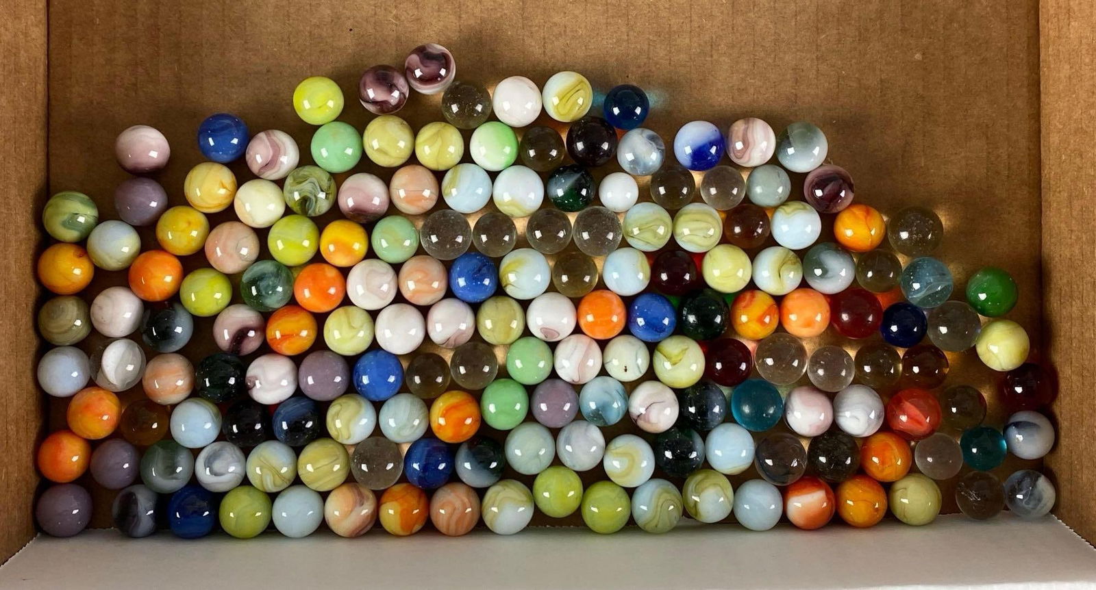 Group of 160+ Assorted Glass Marbles: Largest measures .63”