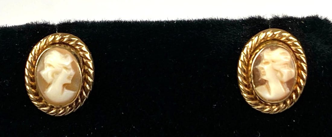 Pair of 14K Yellow Gold Stud Cameo Earrings: Total weight of 1.5 grams, one missing backing, each measures 1/2” H x 1/4” W