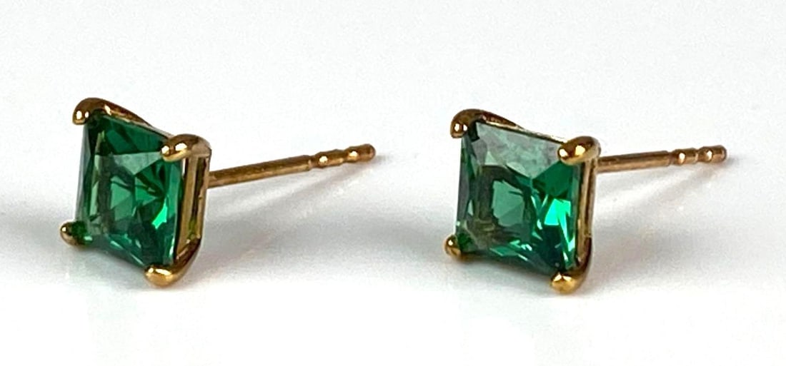 Pair of 10K Yellow Gold Green CZ Stud Earrings: Total weight of 0.3 grams, each measures 1/2” in length