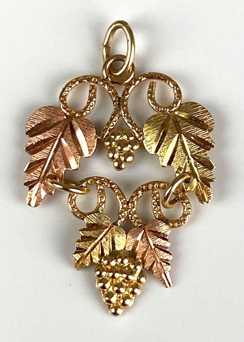 Signed 10K Yellow/Rose Gold Leaf Pendant: Total weight of 0.8 grams, each measures 1” H x 3/4” W
