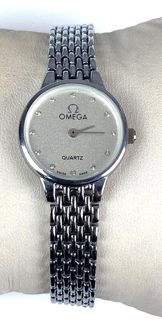Omega DeVille Quartz No. 0827 Stainless Steel Wristwatch: needs new battery, features diamonds on each hour marking, Measures 3 1/2” H x 1” W