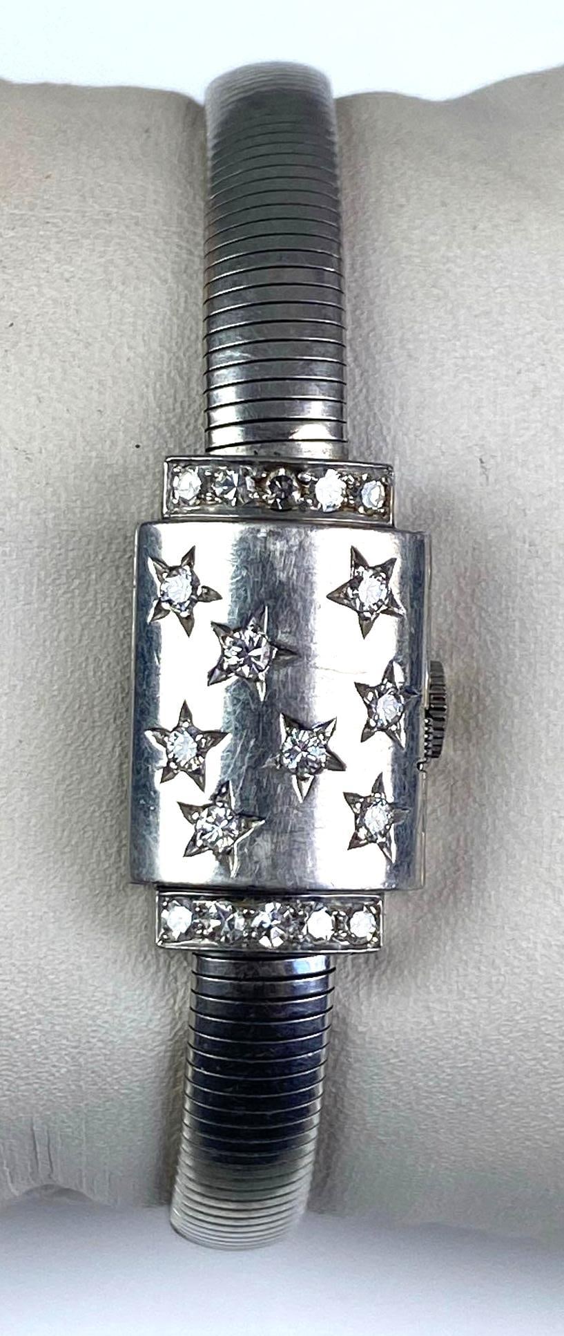 Movado Diamond Flip Cover Wristwatch: did not function in test, marked 10% Irid Plat on clasp, measures 7 1/2” in length