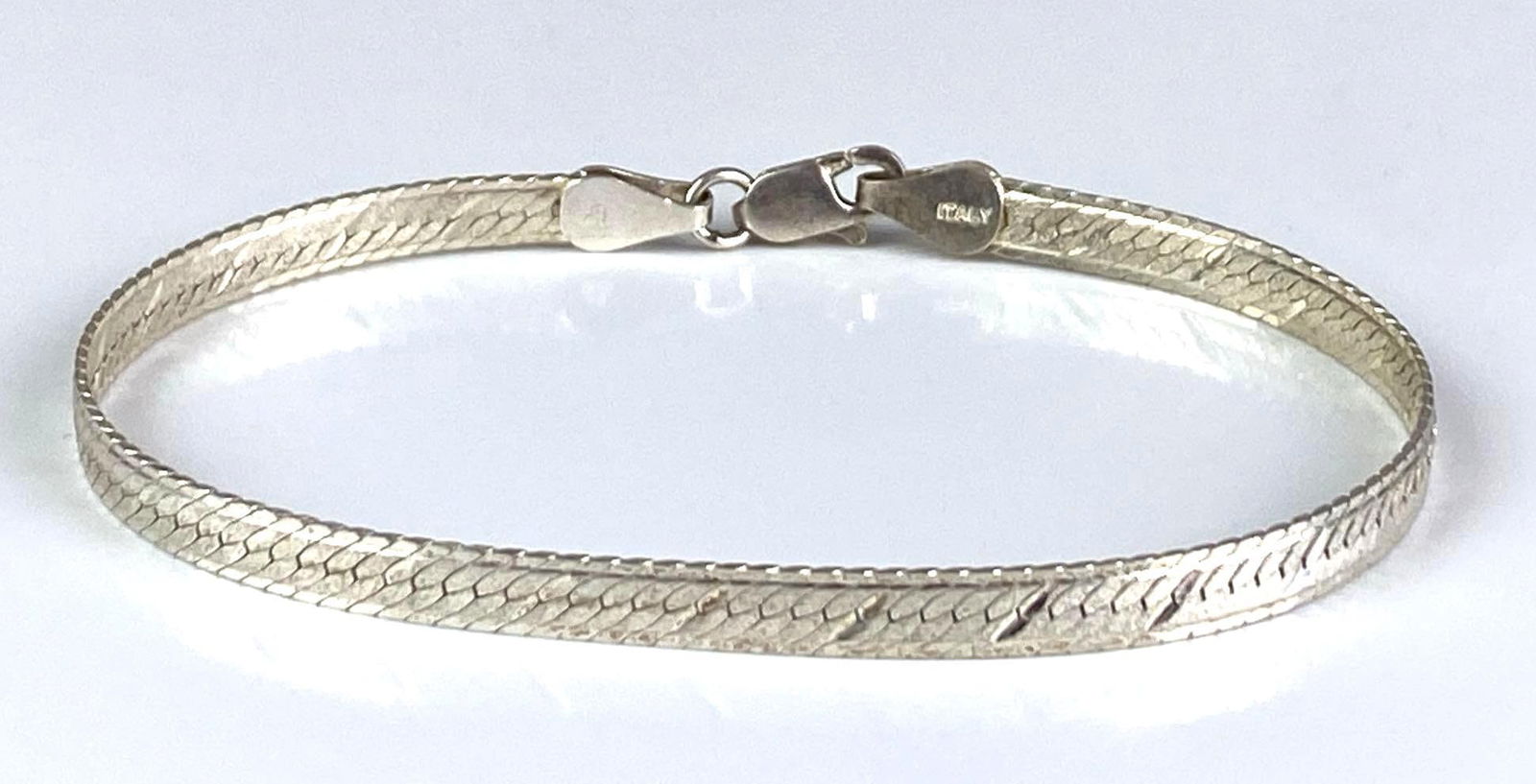 Signed Sterling Silver Italian Herringbone Bracelet: Measures 7” in length