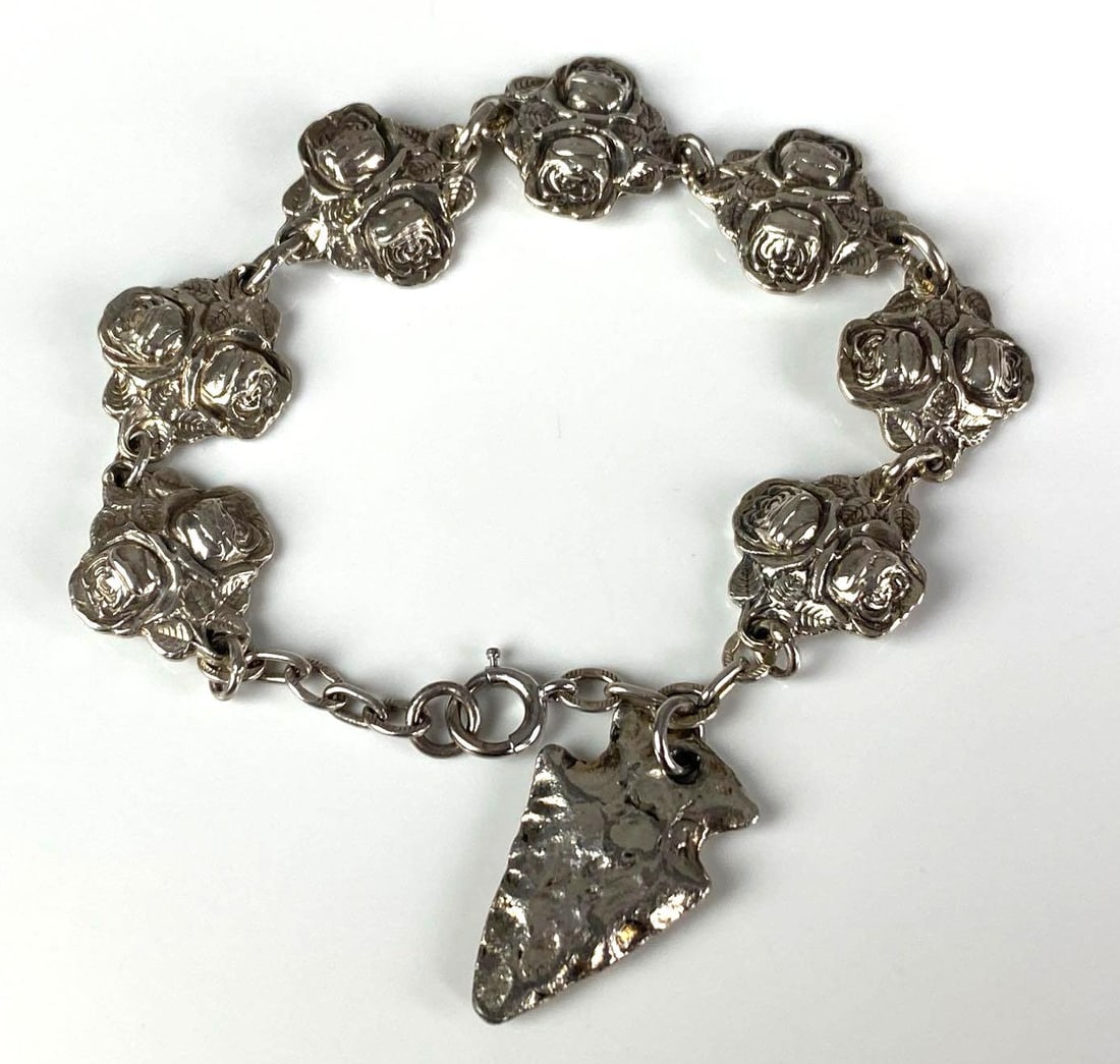 Sterling Silver Religious Roses Bracelet: Features arrowhead charm, measures 7 1/2” in length