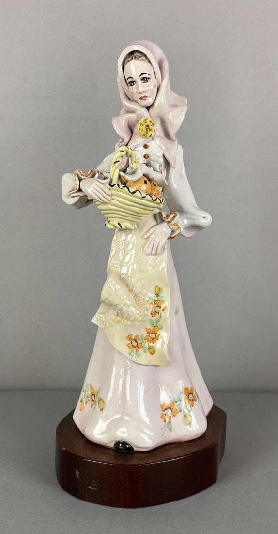 Stelio-Mola of Calgari Signed Woman With Basket Porcelain Figurime: Signed on bottom of dress, measures 11 1/4” H
